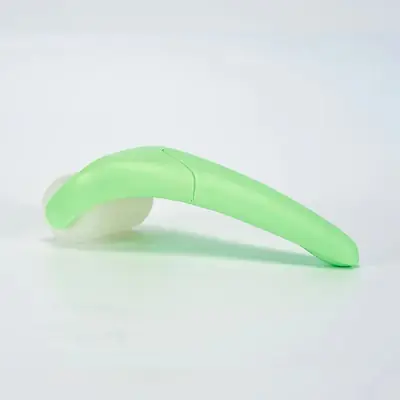 Ice roller being used on the face with gentle upward rolling motion