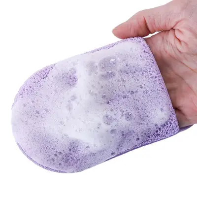 Konjac sponge being used on a hand with gentle circular motion