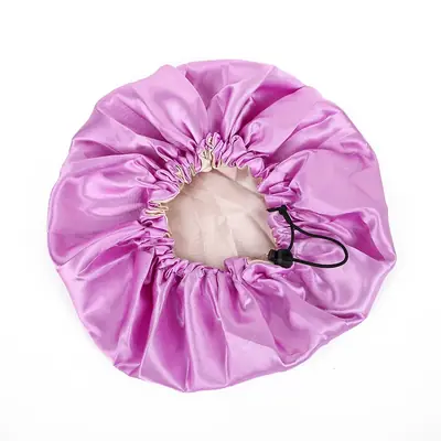 Bonnet displayed in a branded sleeve with hang tag and barcode