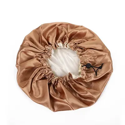 Satin bonnet paired with a matching scrunchie and silk eye mask in a retail bundle