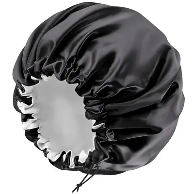 Satin bonnet worn on a head with the drawstring adjusted for a comfortable fit