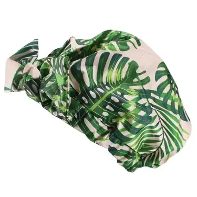 Shower cap worn on a woman's head with long hair, showing secure fit and no slipping