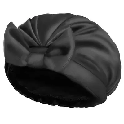 Shower cap folded and packed in a custom polybag with brand label