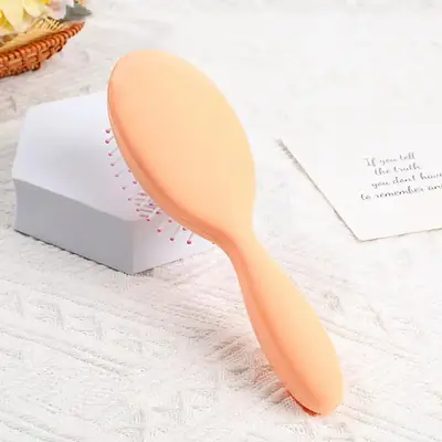 Combs being used on wet hair with gentle pressure applied to the scalp