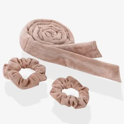 Velvet heatless curler wrapped in hair showing the pin free hold