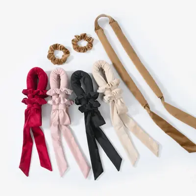 Velvet heatless curler in camel colour laid out flat