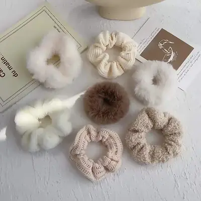Close-up of the knit edge and elastic core on a plush hair scrunchie