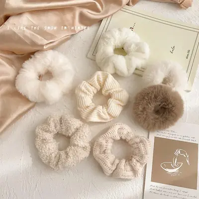 Knit plush hair scrunchie wrapped around a ponytail showing the soft, stretchy hold