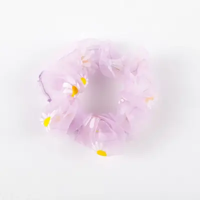 Purple organza scrunchie displayed with a matching hang tag and packaging sleeve