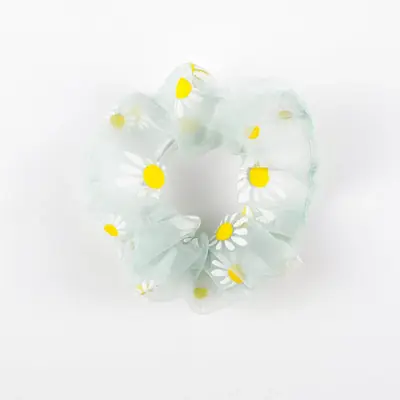 Green organza scrunchie with hand-stitched seam visible on the inside