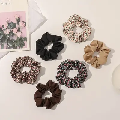 Hair scrunchie wrapped around a section of hair showing the seamless fit