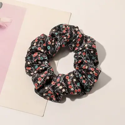 Close-up of the hand-stitched seam on a cloth hair scrunchie
