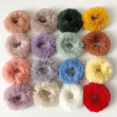 Plush hair scrunchies packed in a custom retail box with branded packaging