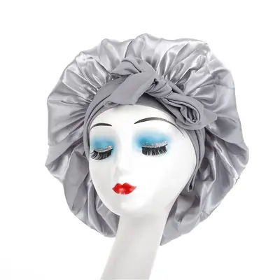 Satin bonnet folded and packed in a custom polybag with brand label