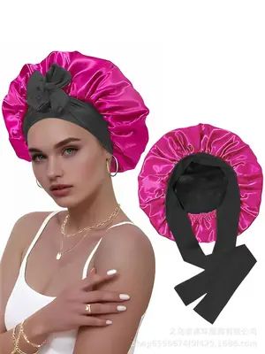 Satin hair bonnet worn on a head with elastic bands adjusted for a secure fit