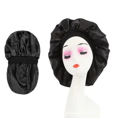 Satin bonnet worn on a head, showing the wide band and smooth fit