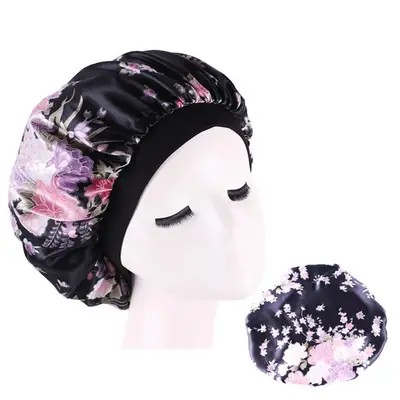 Satin hair bonnet displayed with matching scrunchies and a silk eye mask