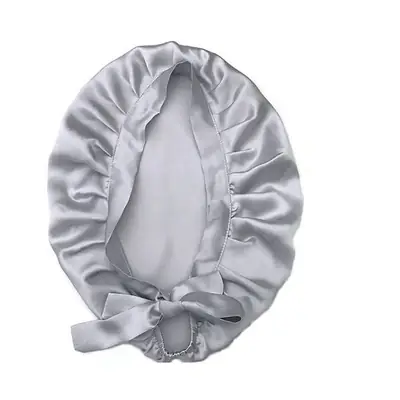 Silk bonnet displayed with matching scrunchie and hair tie as a gift set