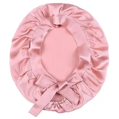 Silk hair bonnet packed in a custom polybag with brand label