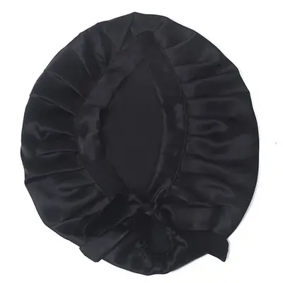 Silk hair bonnet worn on a head, with ribbons tied at the back
