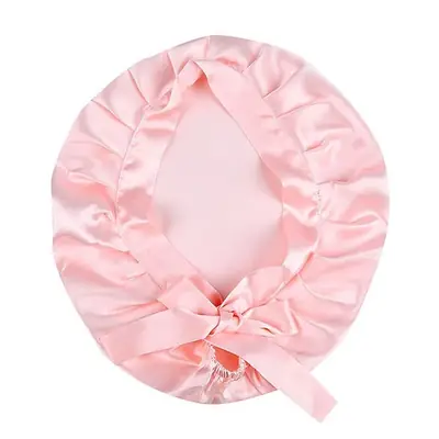 Silk bonnet with adjustable ribbons tied in a bow, showing fit and comfort