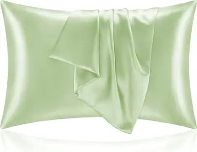 Silk pillowcase used on a bed with a person sleeping, showing the smooth surface