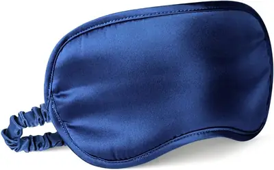Eye mask with a bedazzled design on the satin surface, showing decorative detail