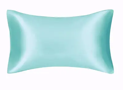 Satin pillowcase shown with a silk eye mask and hair tie as part of a sleep set