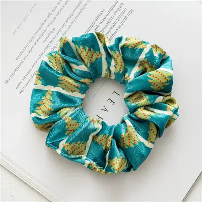 Hair band wrapped around a ponytail showing the soft, non-damaging fit