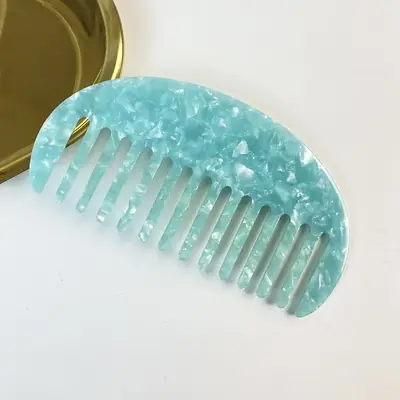 Comb with tortoise shell pattern under natural light showing depth