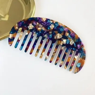 Comb displayed with a satin bonnet and scrunchie as part of a bundle
