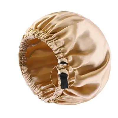 Satin night bonnet with the adjustable strap fully extended