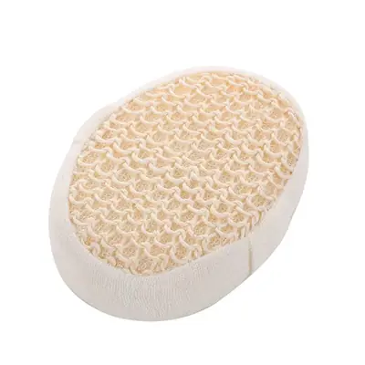 Sisal bath ball placed on a wooden surface with natural soap and bamboo brush