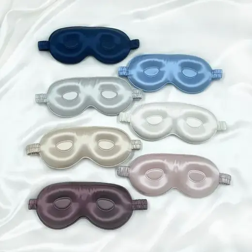 3D silk sleep mask laid flat showing the contoured eye cover and adjustable strap