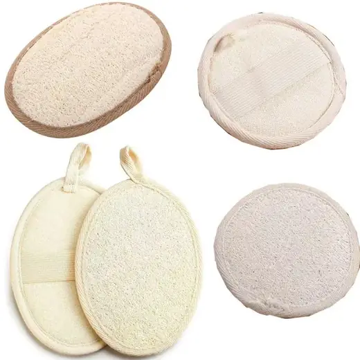 Natural loofah sponge pad with terry cloth backing and elastic hand strap laid flat