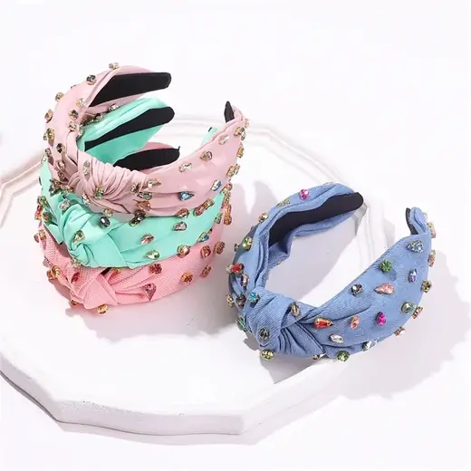 Handmade fabric headband laid flat showing the hand-stitched edges and soft fabric surface