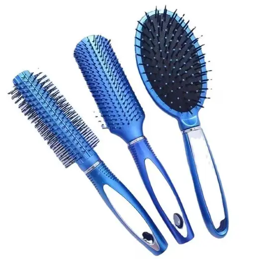 Three cushioned hair combs laid out in a row, showing the air cushion base and rounded pins