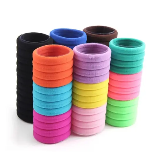 Set of soft cotton-covered hair ties laid out flat in various custom colours