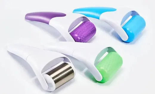 Metal ice roller with smooth polished surface and non-slip handle