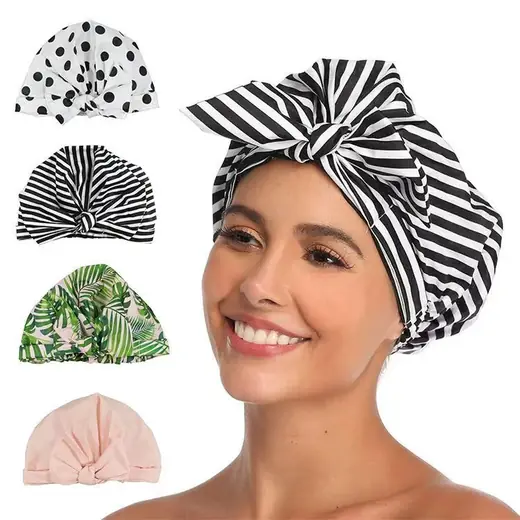 Reusable shower cap for women with silicon edge, laid flat showing the polyester surface