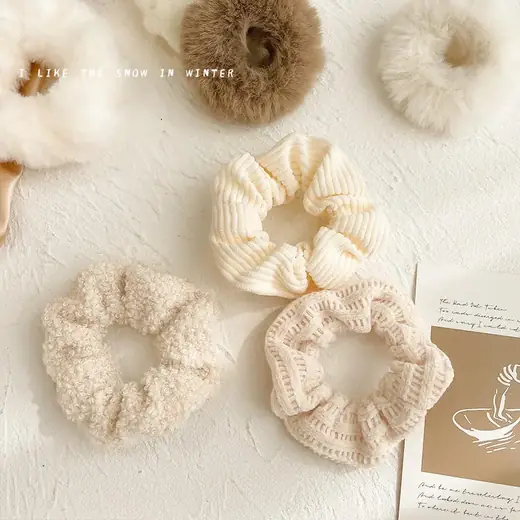 Set of multi-style knitting plush hair scrunchies laid out flat in various colours and shapes