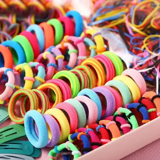 Set of mixed colour nylon hair ties laid out with different shapes and sizes