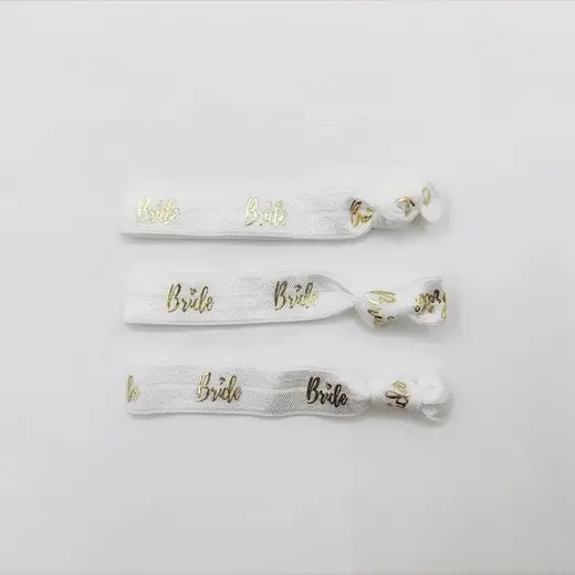 Hair tie with custom logo printed on the band, placed on a white background