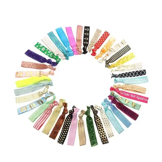 A set of knotted elastic hair ties laid out in different custom colours