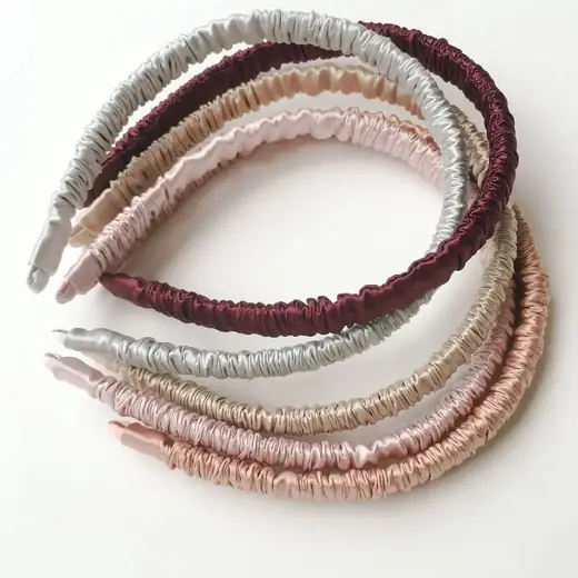 100% silk vintage-style headband laid flat showing the smooth silk surface