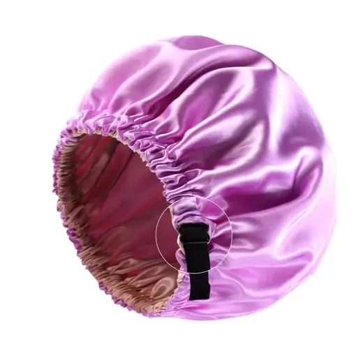 Women sleeping stain night bonnet with adjustable wrap laid flat