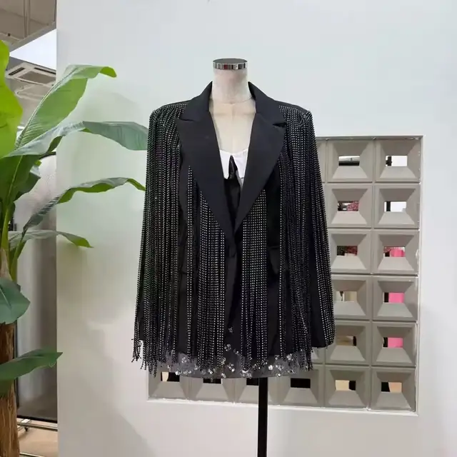Black tailored blazer covered in crystal chain fringe with notch lapels