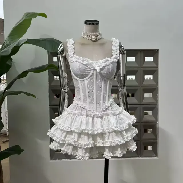 White broderie anglaise corset mini dress with three tiered ruffle skirt