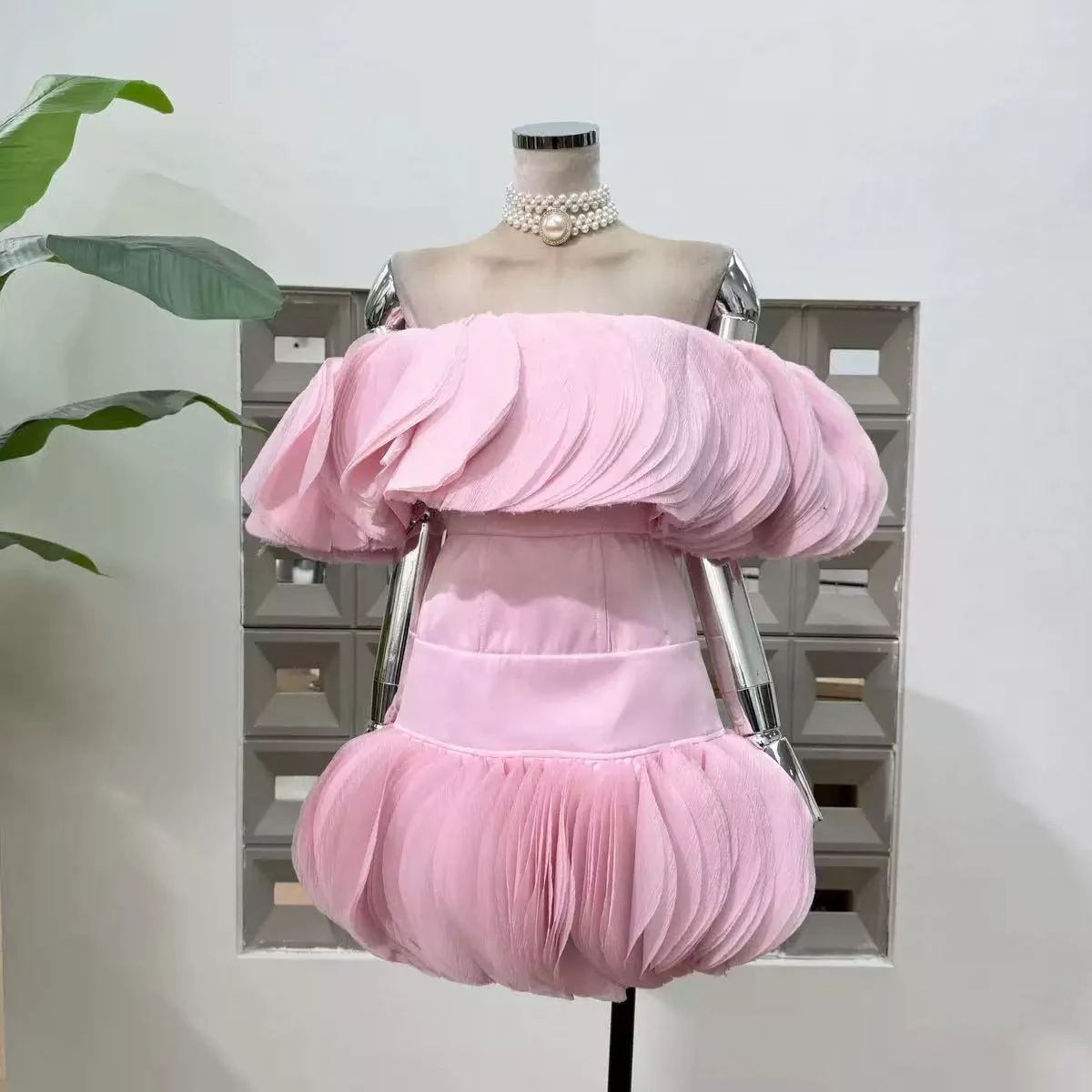 Pink chiffon off shoulder dress with petal ruffles and a bubble hem