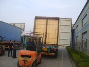 Container stuffing at the loading point, where counts, part numbers and visible condition are checked against the packing list